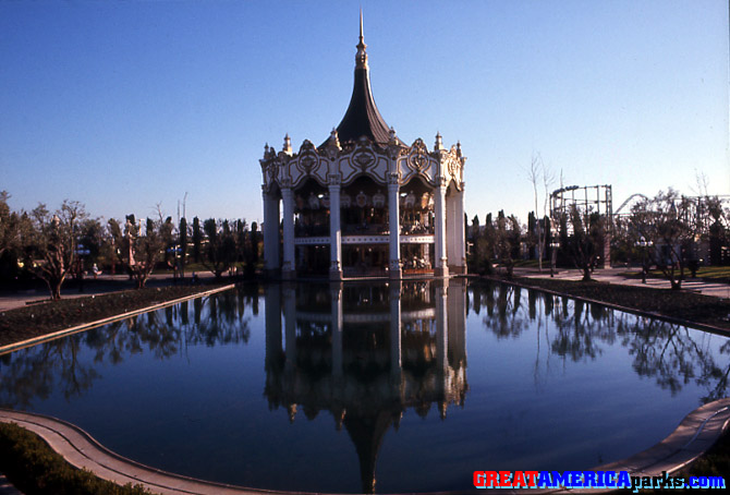 reflecting Columbia
The Carousel Columbia is reflected here in the still waters of the pool. In the background on the right are the lift hills of the [i]Willard's Whizzer[/i] and [i]Turn of the Century[/i] roller coasters.

