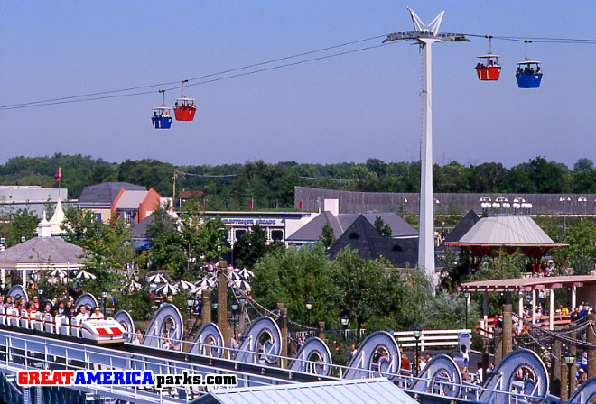 Gurnee's Delta Flyer / Eagle's Flight
Gurnee, IL

Delta Flyer / Eagle's Flight passes over Orleans Place and Yankee Harbor.  [i]The Tidal Wave[/i] is seen in the foreground.  The Cajun Cliffhanger is on the right.
Keywords: Gurnee