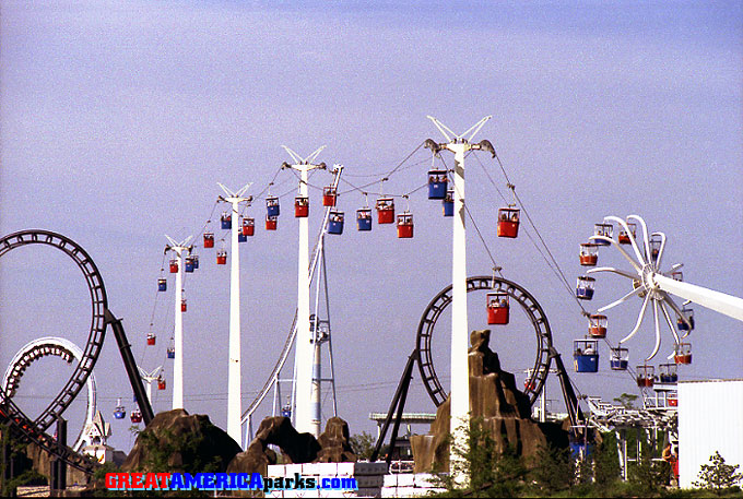 busy Southern Cross
Gurnee, IL -- 1980
Lots of cabins out on the cable indicate that it's a busy day for the Southern Cross. Note the Southern Cross ride operator with a red cabin at the south end station.
Keywords: Gurnee