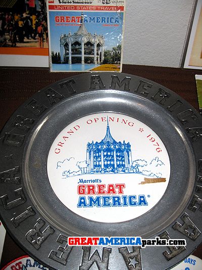 An original grand opening plate from the 1976 opening of the California park. Also in the photo is a set of View-Master reels from the 70's. The reels include photos of rides and attractions from each park.
