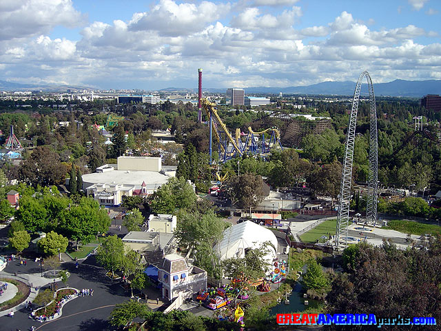 park overview from tower
17 April 2004
Santa Clara, California
In this overview of the park from the tower, the only Marriott-era ride readily visible is the [i]Demon[/i] roller coaster, marked by the three white flagpoles atop its lift hill on the far right. The large building towards the left is the Grand Music Hall, now named the Great America Theater.
