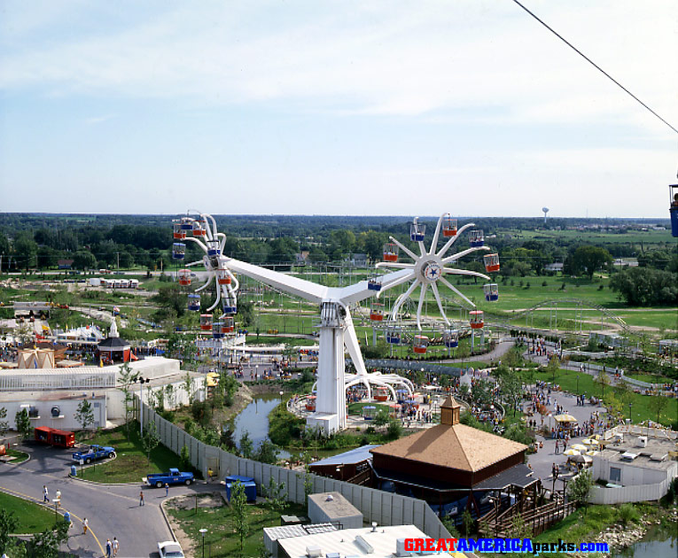 Sky Baler
Gurnee, IL -- 1977
This view of the Sky Whirl is from the Southern Cross skyride. The building with the brown roof in the foreground housed the Hay Baler ride. The Hay Baler was added to Gurnee, but was never added to Santa Clara.
Keywords: Gurnee