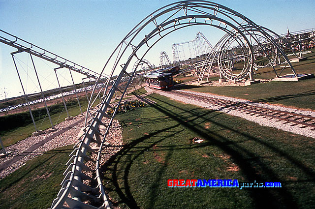 entering the corkscrew
Gurnee, IL
This is a front-seat view as a train is about to enter the corkscrew. In the background, the coaster's first three drops are visible. The drop into the corkscrew was the fourth drop. In this shot, the GREAT AMERICA Scenic Railway train has just passed under the corkscrew.
Keywords: Gurnee