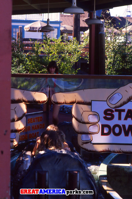 stay down
Big flaps instructed passengers to stay down.  This was to try to have the passengers remain seated until the boat had fully engaged the turntable.  Otherwise, exiting the boat prematurely could be hazardous.
