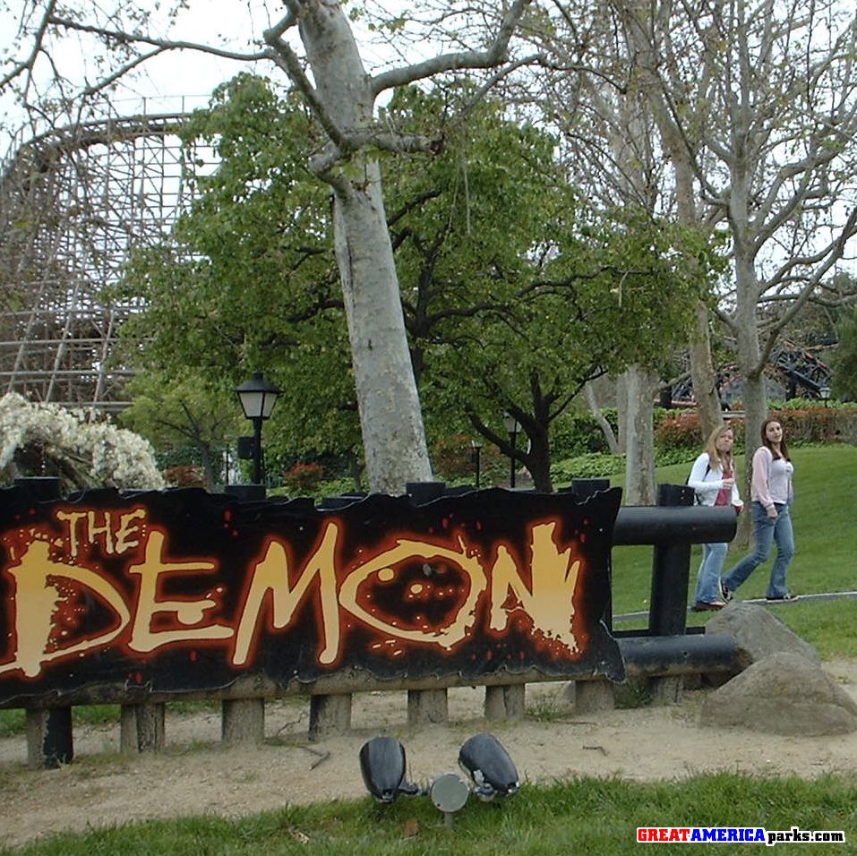 Demon sign
Here's the updated sign and you can see a hint of black and red-orange track of the corkscrews in the background through the trees.
