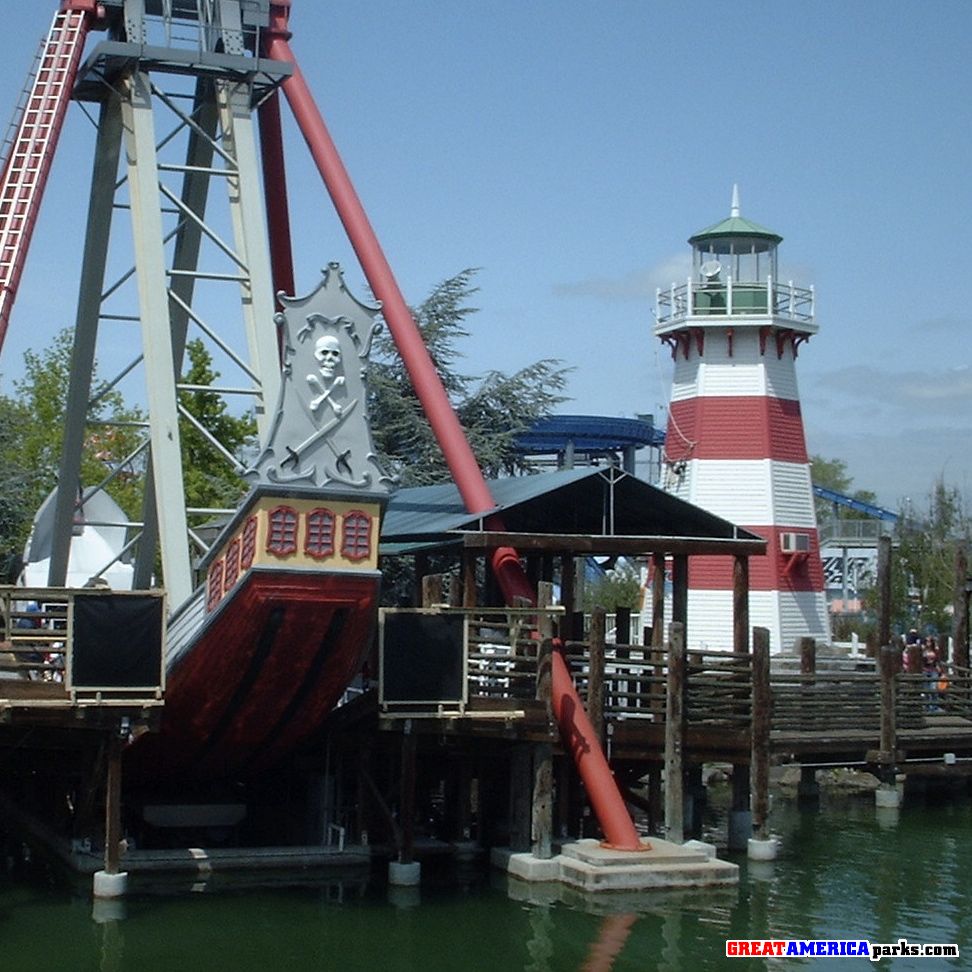 Yankee Harbor
This is from the boardwalk right next to the entrance to what used to be the Yukon Territory. As you can see here is THE BEST RIDE EVER -cough-... I mean our Intamin Looping Starship the HMB Endeavor, which was constructed right in the middle of the harbor off the boardwalk. You can see next to it the Yankee Clipper Lighthouse with its new "Australian" theme. Although I like the red and white, the snorkel and other crap (which I hate) that is nailed to the other side has faded extremely over the past few years.
